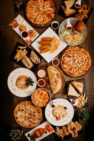 top-view-meals-tasty-yummy-different-pastries-dishes-brown-surface top-view-meals-tasty-yummy-different-pastries-dishes-brown-surface